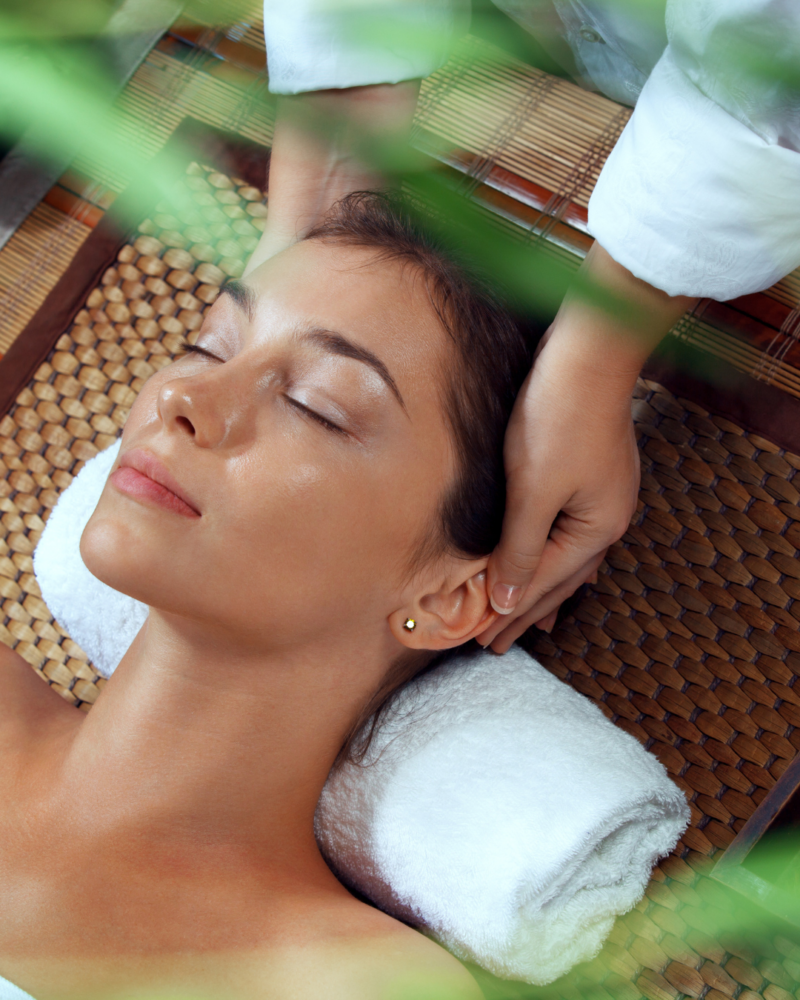 Woman receiving Thai inspired massage at spa in Arlington, TX