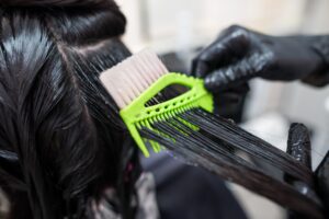 Hair Straightening Treatments - Hair being straightened